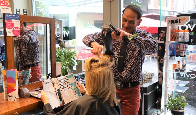 Vivo salon stylist and manager Peter doing a blow wave on a client