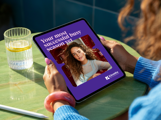 busy season salon ebook being read by salon owner