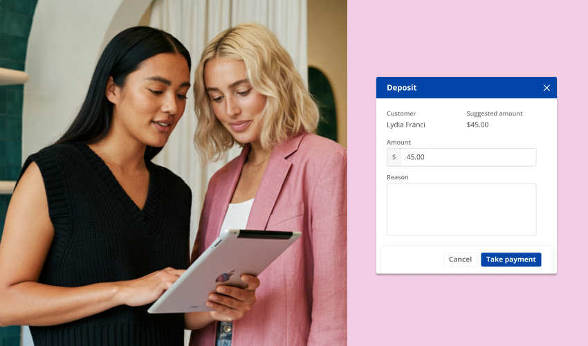 two-salon-workers-adding-deposit-on-tablet